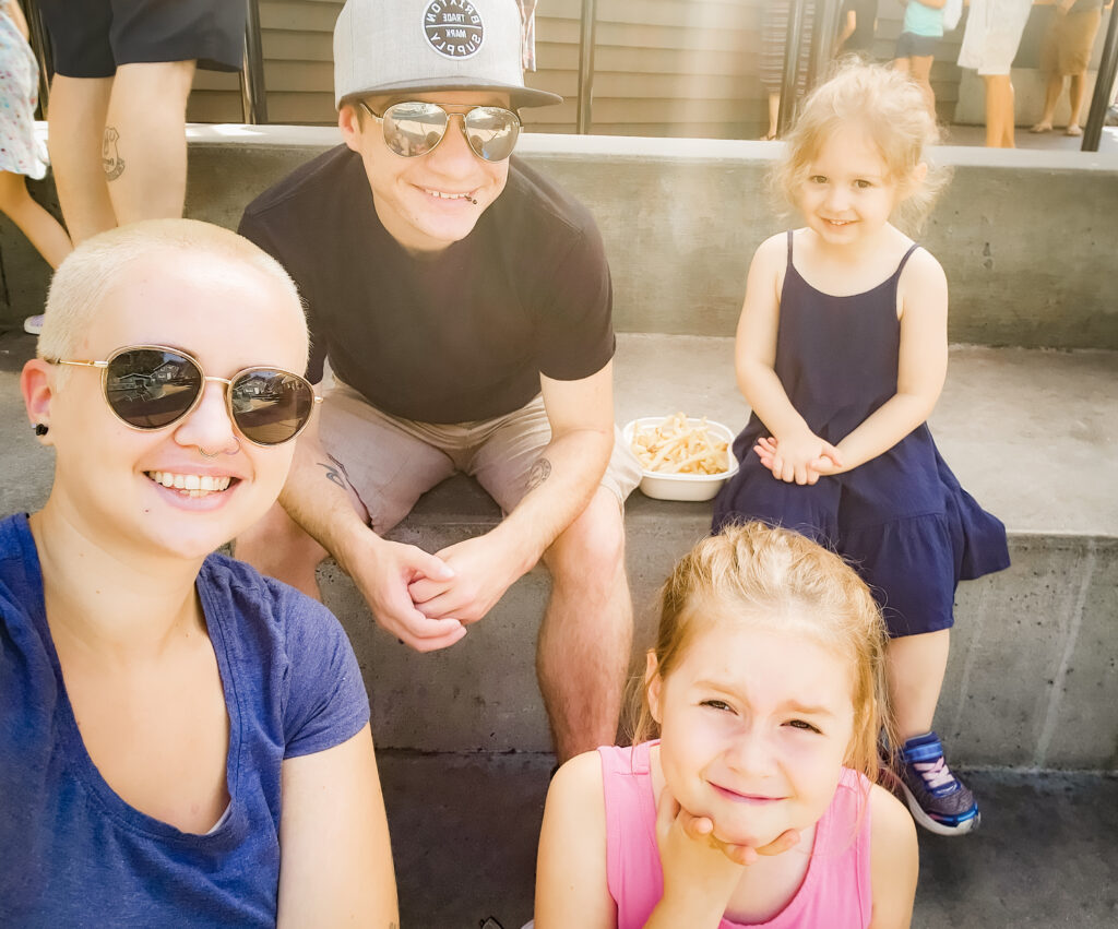 a family photo of 2 adults and 2 children